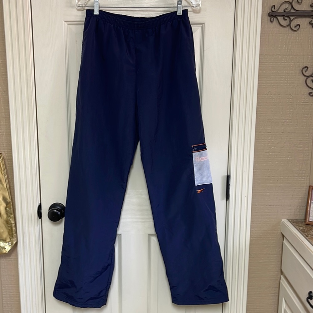 Reebok size large wind pants. All purpose sport. Mesh lining.